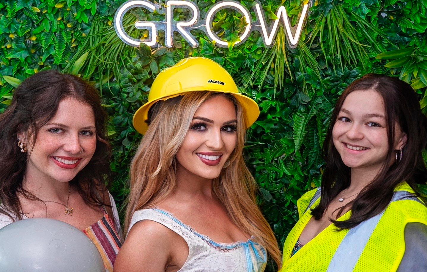 GROW neon sign with team
